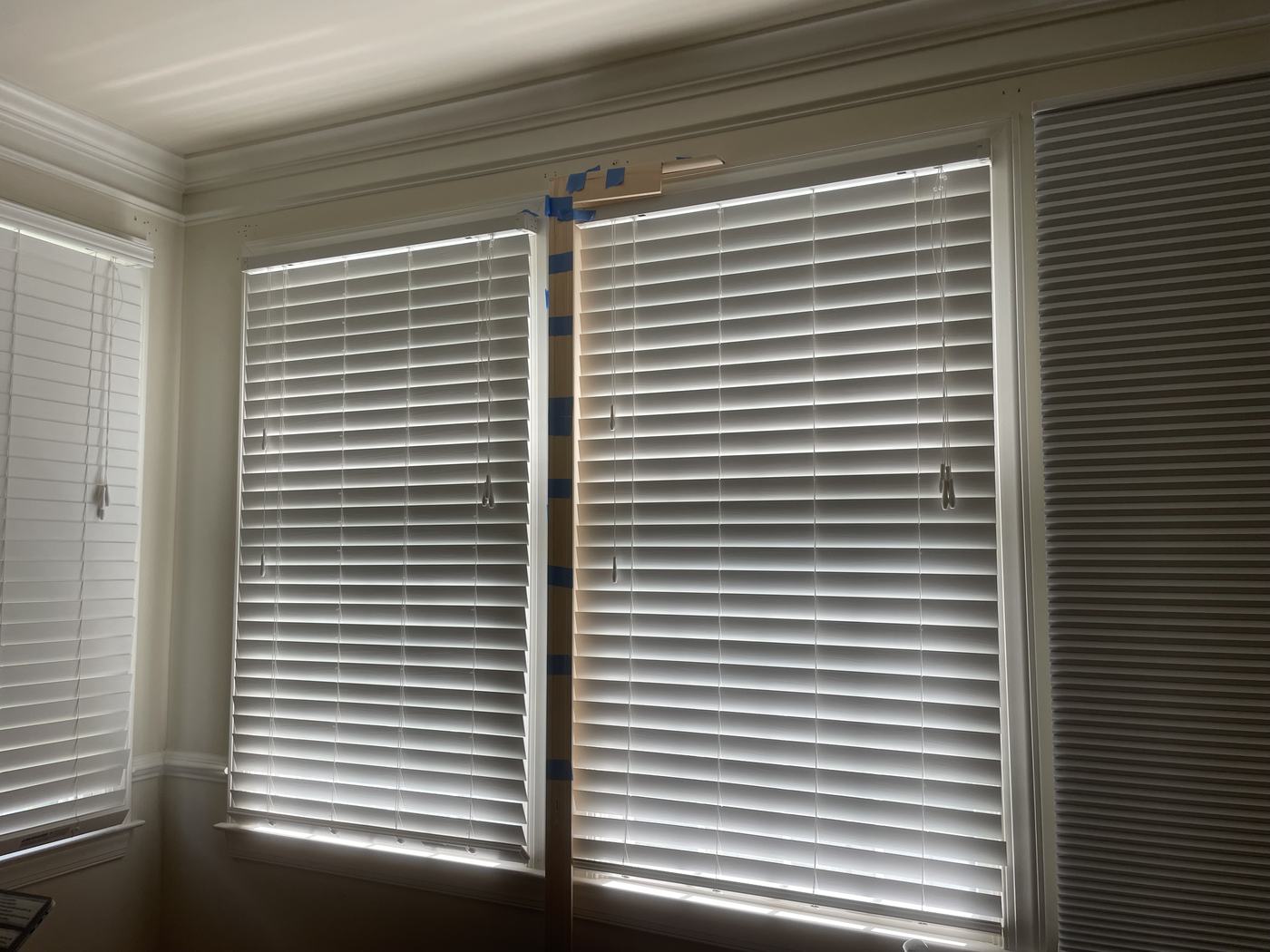 Bedroom window wall with aluminum blinds, before