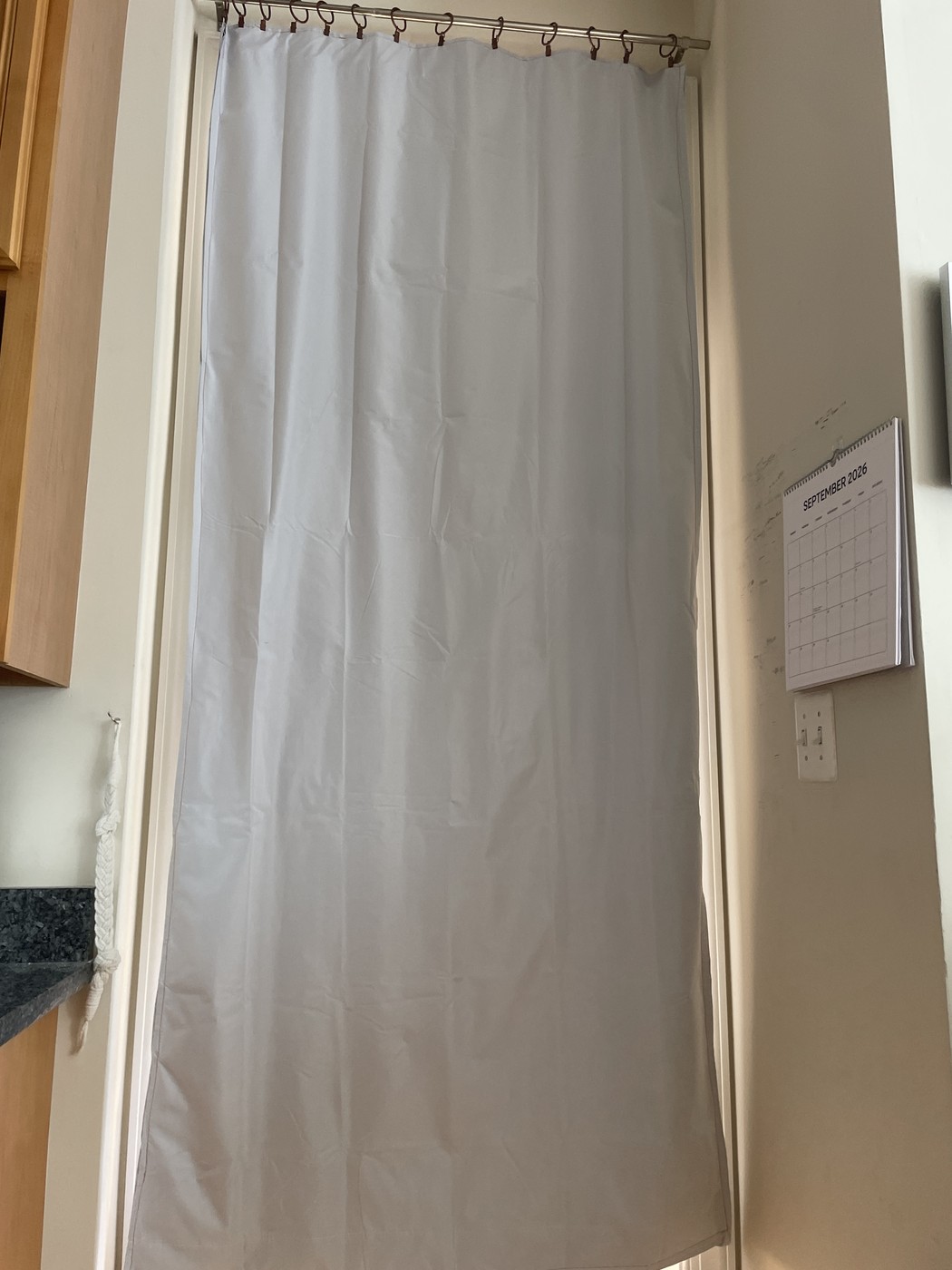 Curtain drawn closed across the study doorway