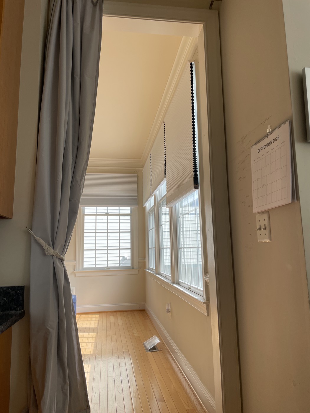 Curtain tied back, open into the study