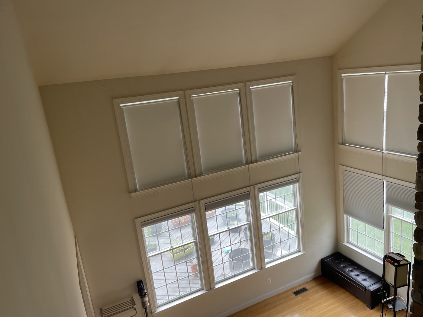 Two-story family room with cellular shades on both the upper and lower windows