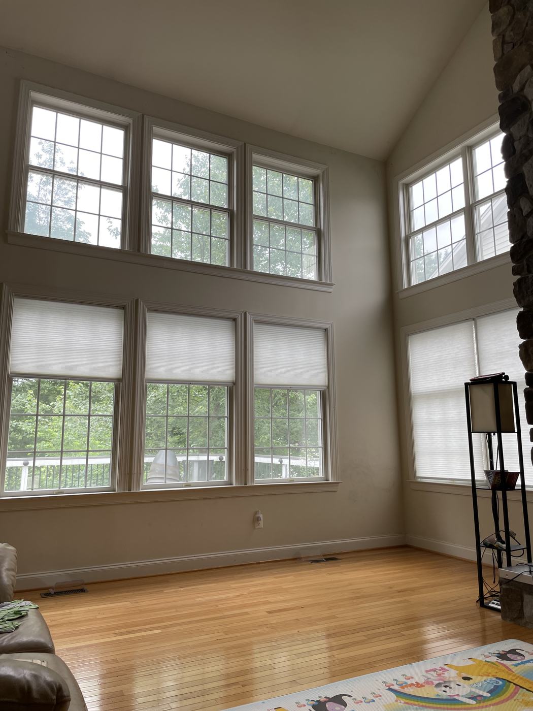 Two-story great room windows with bare upper windows, before