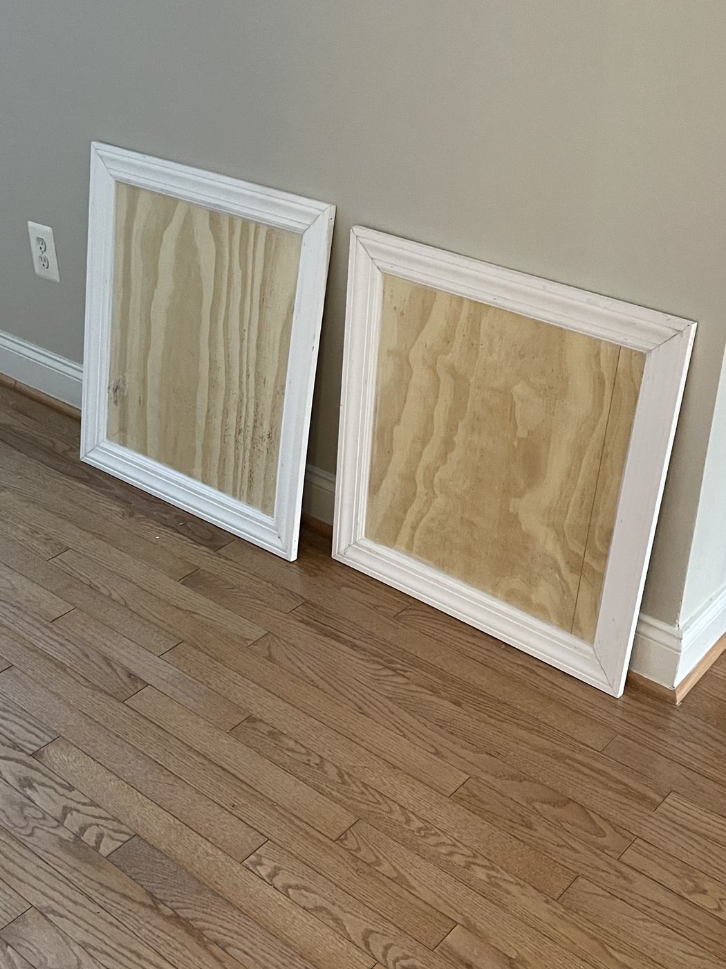Custom-built wood access panel painted to match the wall