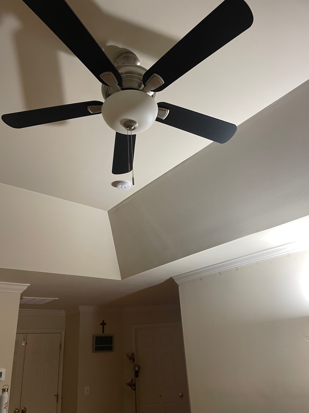 Ceiling fan with a light kit on a vaulted ceiling, after replacement